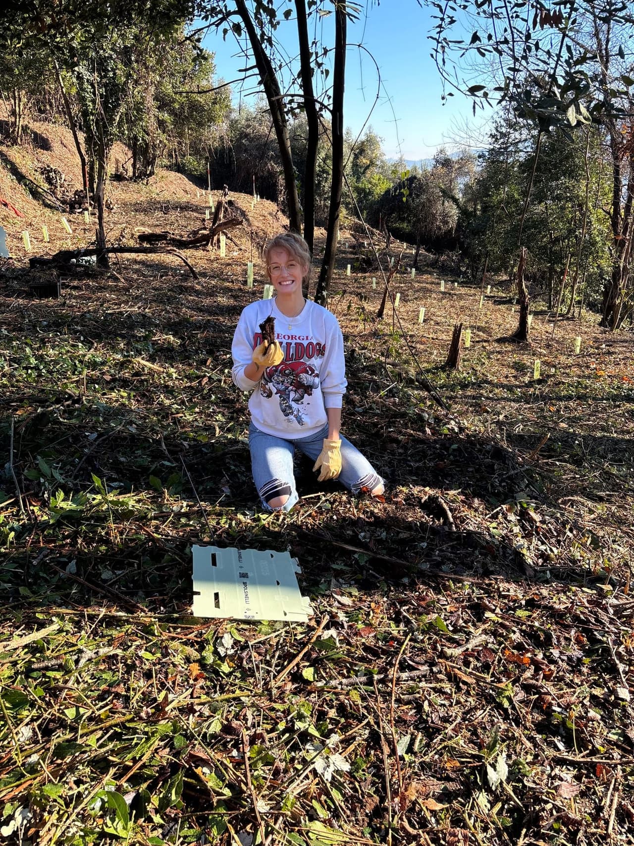 Volunteer team gathered on site to plant and care for native trees
